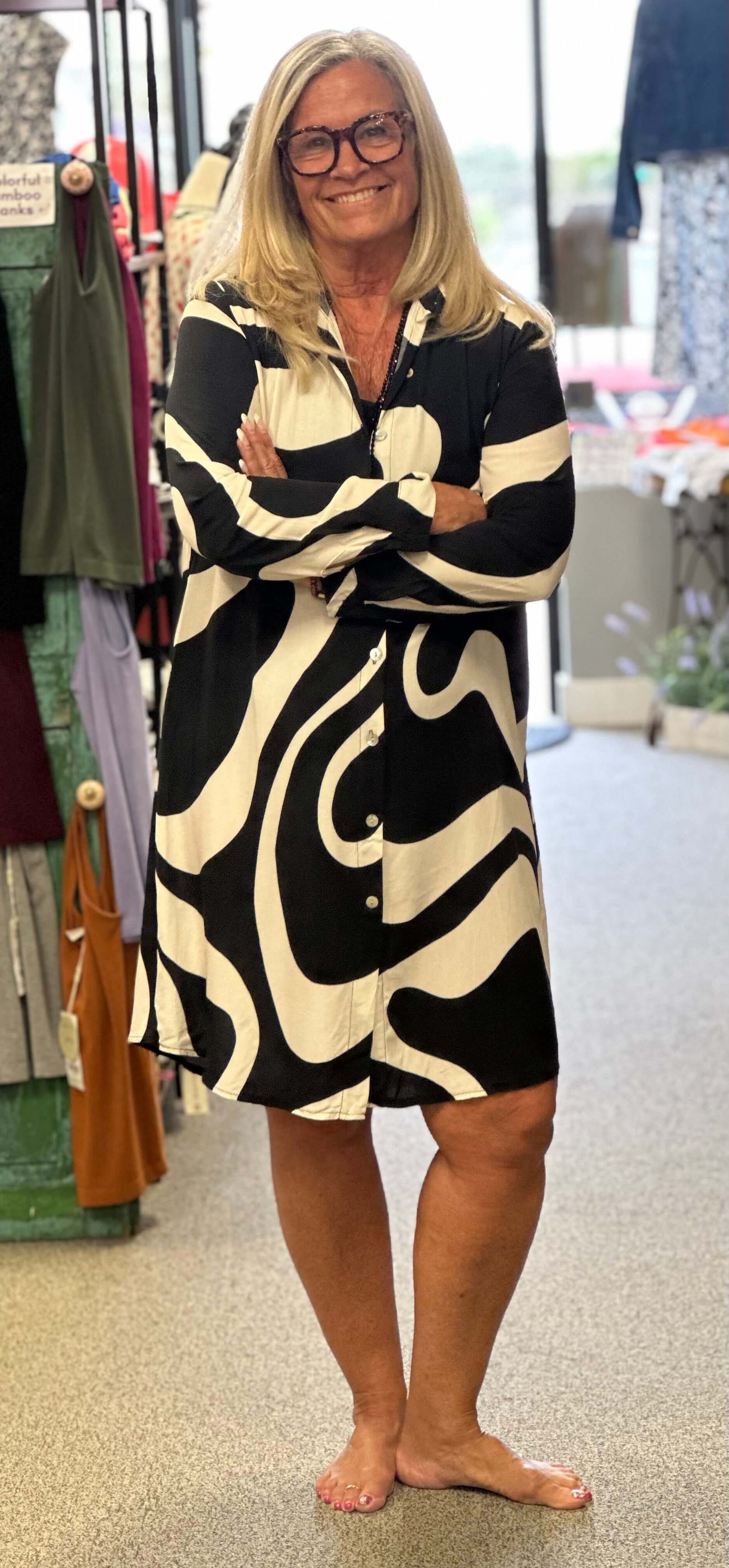 Two for one is what you'll get with this black combo top. You can wear it open as an over piece, button it up with leggings or wear it as a dress. Pick your pleasure.
