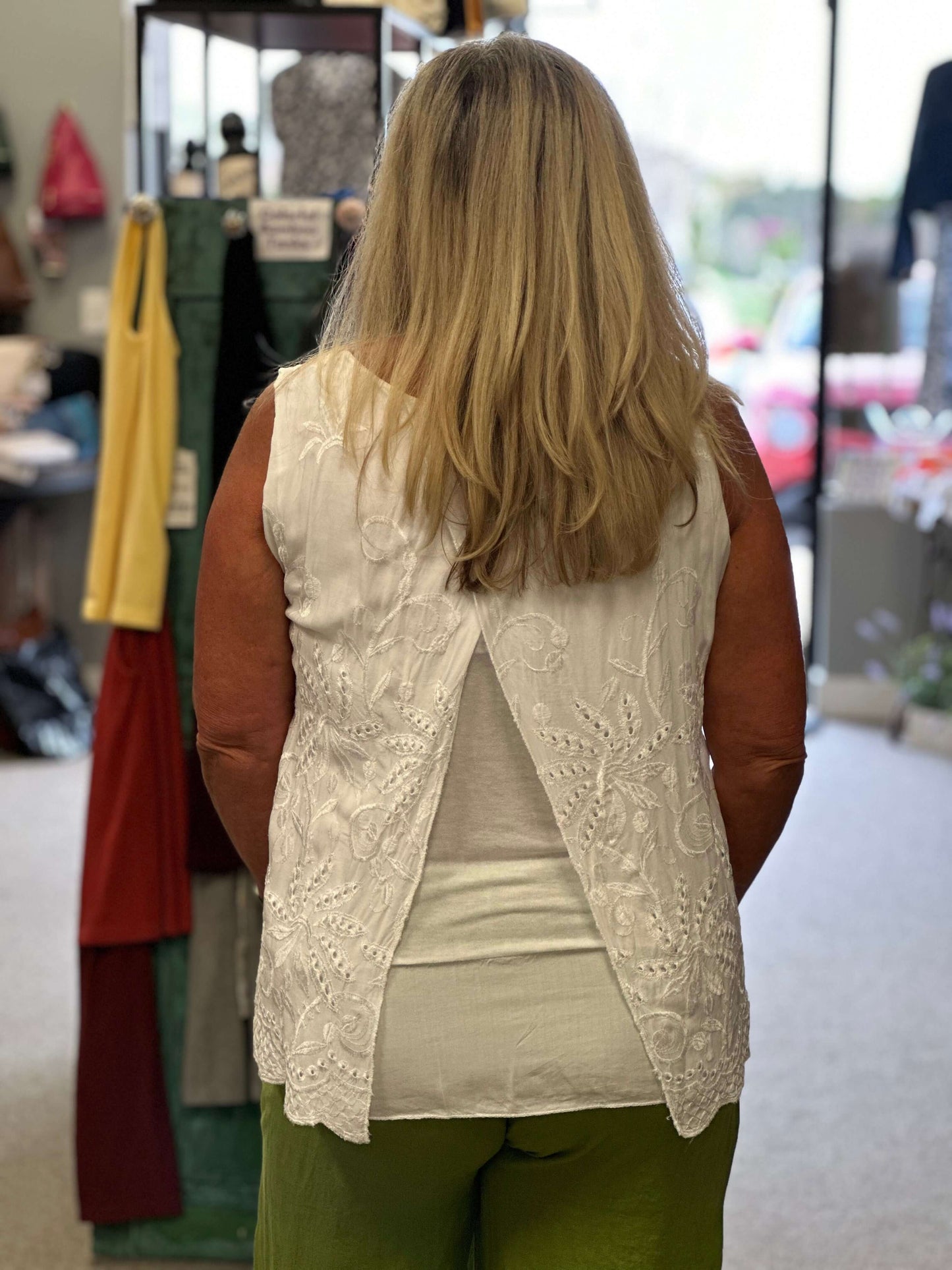 A beautiful eyelet sleeveless top with a cami underneath that is longer in length. Two perfect colors to choose from, which will go with everything.