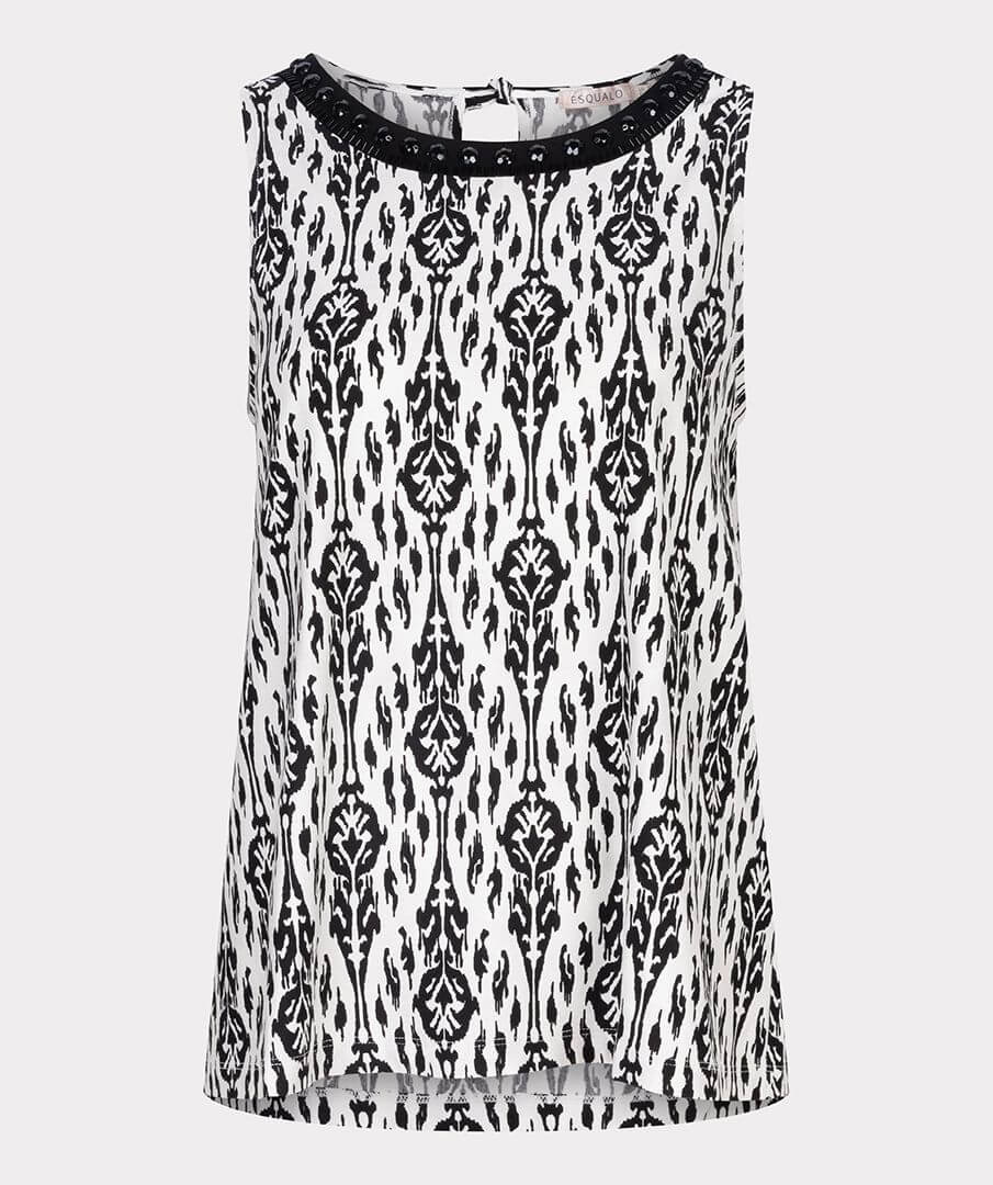 An elegant sleeveless top with tie detail at the back and pretty beads around the neckline. Easy to combine with neat pants, skirts or jeans worn tucked in or out.