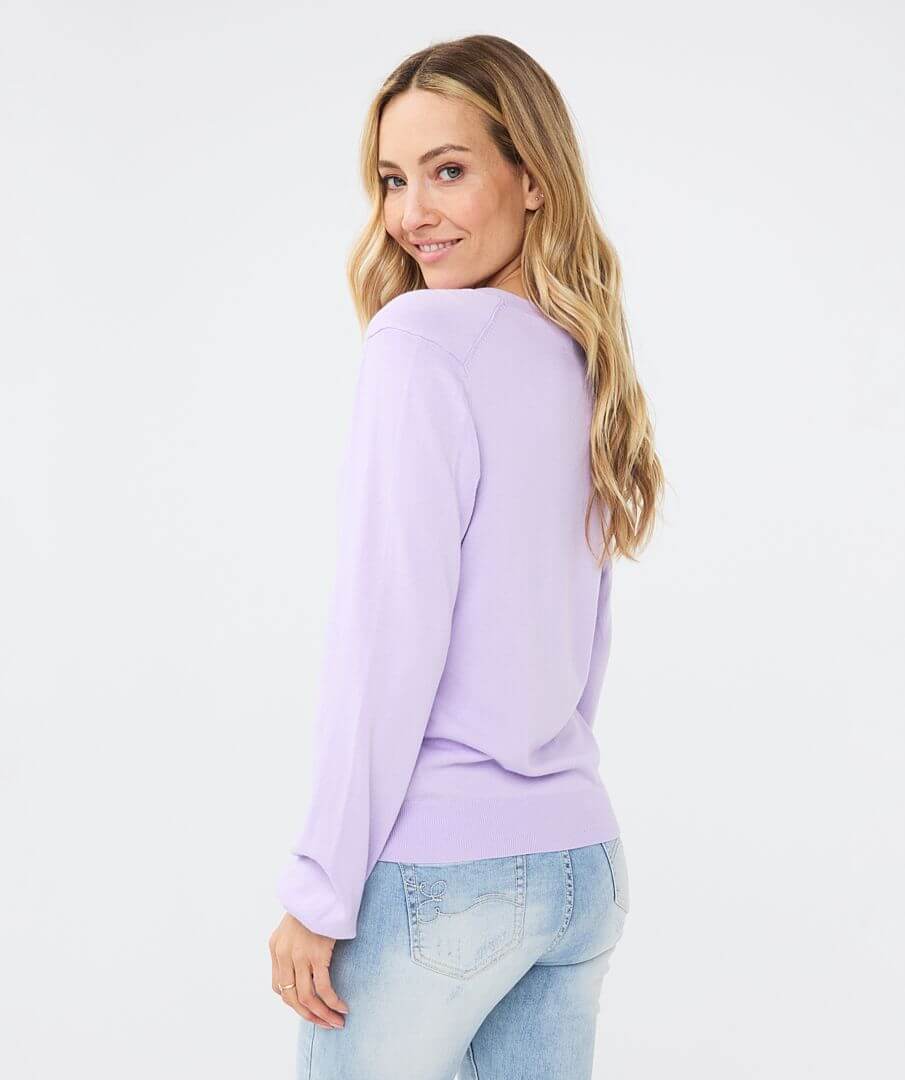 Soft v-neck cardigan with shell buttons, long sleeves and ribbed cuff/hemline. This will be perfect for an over piece or just on its own. The color is beautiful.
