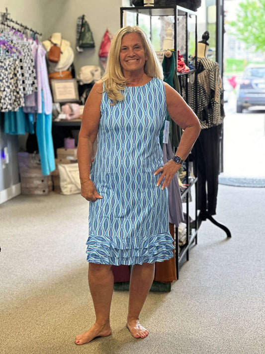 Beautiful blend of colors in this ruffle hem dress. Sleeveless, round neck, lightweight, cooling element and UPF50+. Elegant or fun!