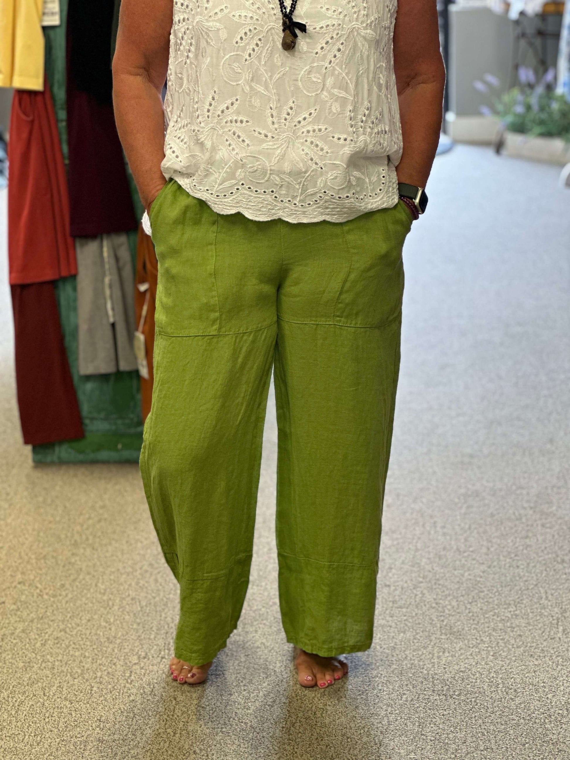 Pull on linen capris with front pockets in a fun green. These will be a go to because of the comfort, style and color.