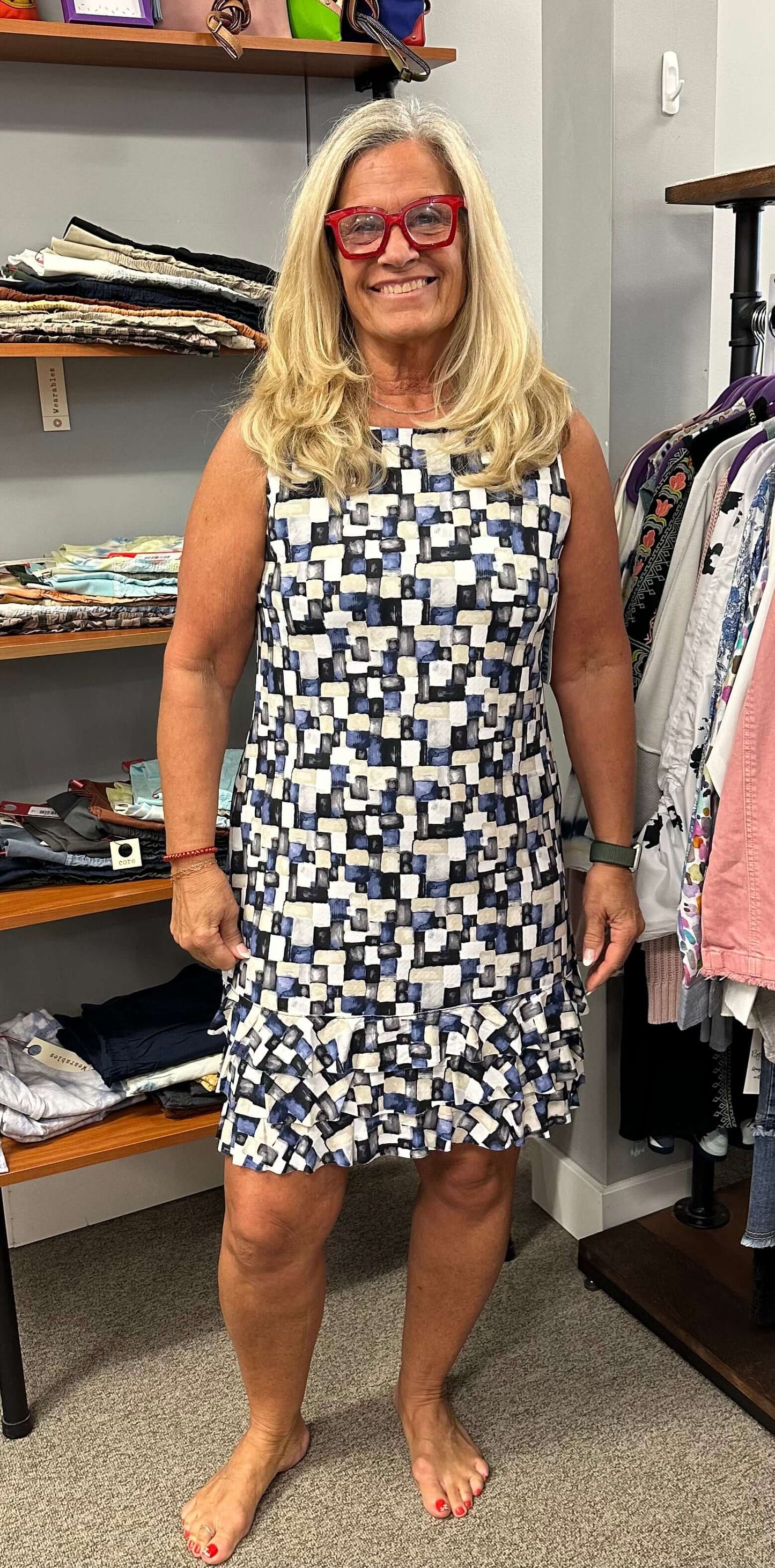 All Lulu b sleeveless dresses are adorable but I especially love this one. The array of blue tones, tan, grey, and black along with a ruffle bottom makes it unique and fun. Looks great on its own or with a jacket over it. UPF50+ and cooling element.