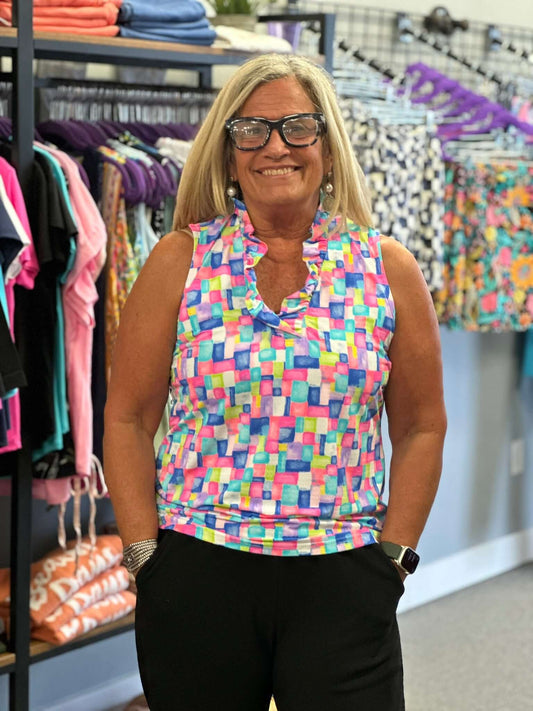 The perfect sleeveless colorful top with half zip detail. Includes UPF50+, cooling element AND ultra wicking fabric.