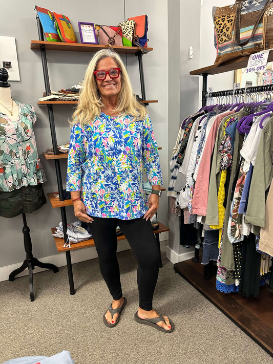 3/4 sleeve, round neck top with a variety of colors, blues, pink, lime, and turquoise in a flower pattern. Adorable on, and 100% cotton, so perfect for all year round.