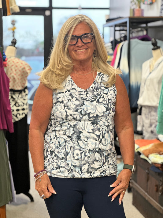 Beautiful blues is part of this sleeveless top with an elastic hemline, which allows you to tuck in or wear it out. Matching skirt makes a great set and when its tucked in, it looks like a dress.