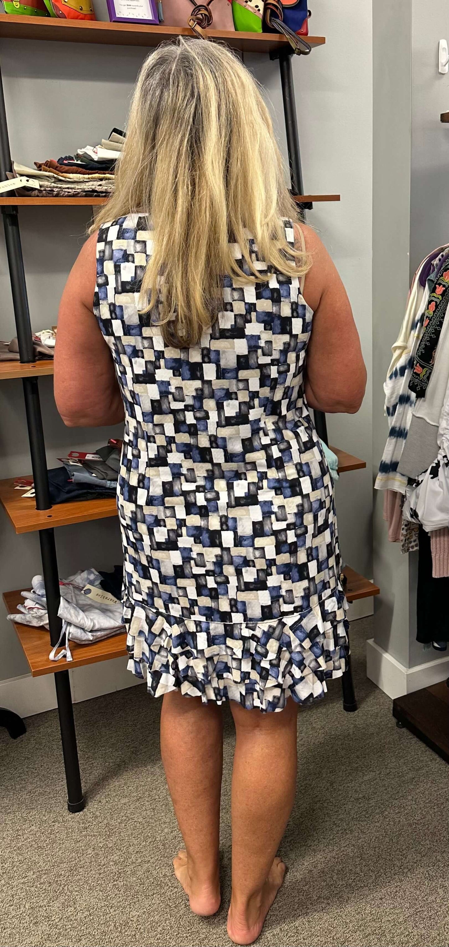 All Lulu b sleeveless dresses are adorable but I especially love this one. The array of blue tones, tan, grey, and black along with a ruffle bottom makes it unique and fun. Looks great on its own or with a jacket over it. UPF50+ and cooling element.