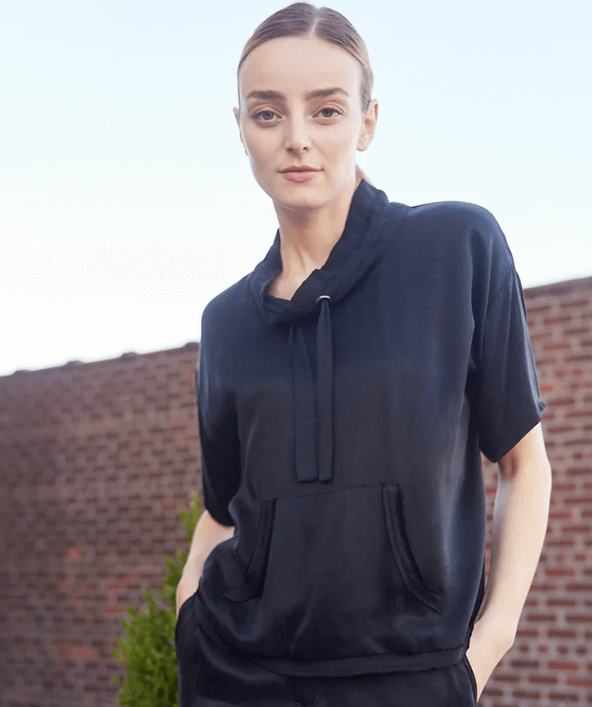 Drop shoulder black top with neck detail, pouch pocket and short sleeves. Dress it up or down. Goes perfectly with our cargo skirt.