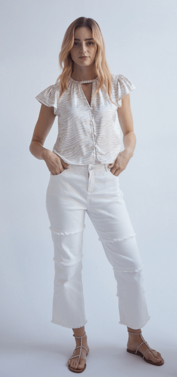 Super cute and different zip up jean, with front &amp; back pockets, great stretch, along with raw edge piping on the leg and at the hemline. The perfect off white, which will go with anything in your wardrobe.