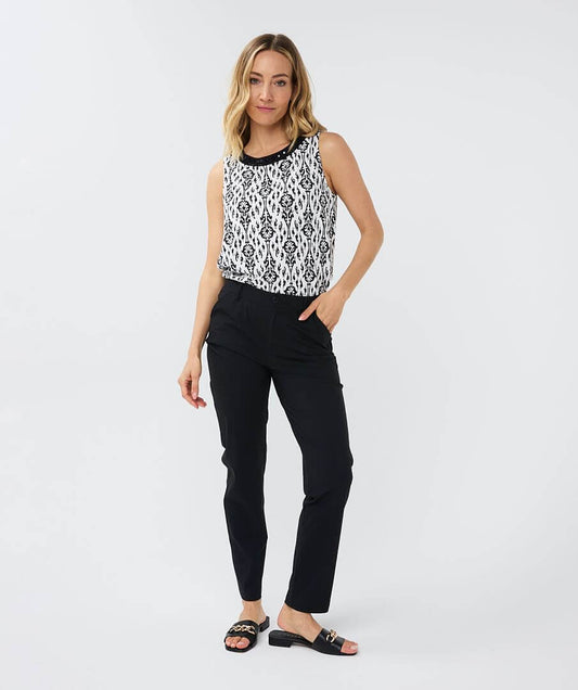 An elegant sleeveless top with tie detail at the back and pretty beads around the neckline. Easy to combine with neat pants, skirts or jeans worn tucked in or out.