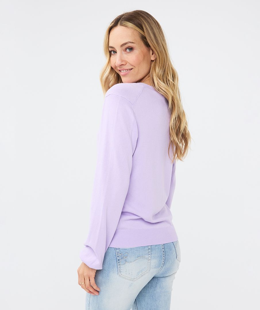 Soft v-neck cardigan with shell buttons, long sleeves and ribbed cuff/hemline. This will be perfect for an over piece or just on its own. The color is beautiful.