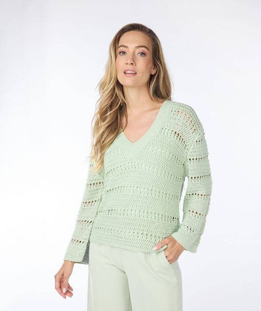 This crochet sweater is a beautiful pistachio color, v-neck and the sleeves have a slight bell to them. Any color cami looks great under it.