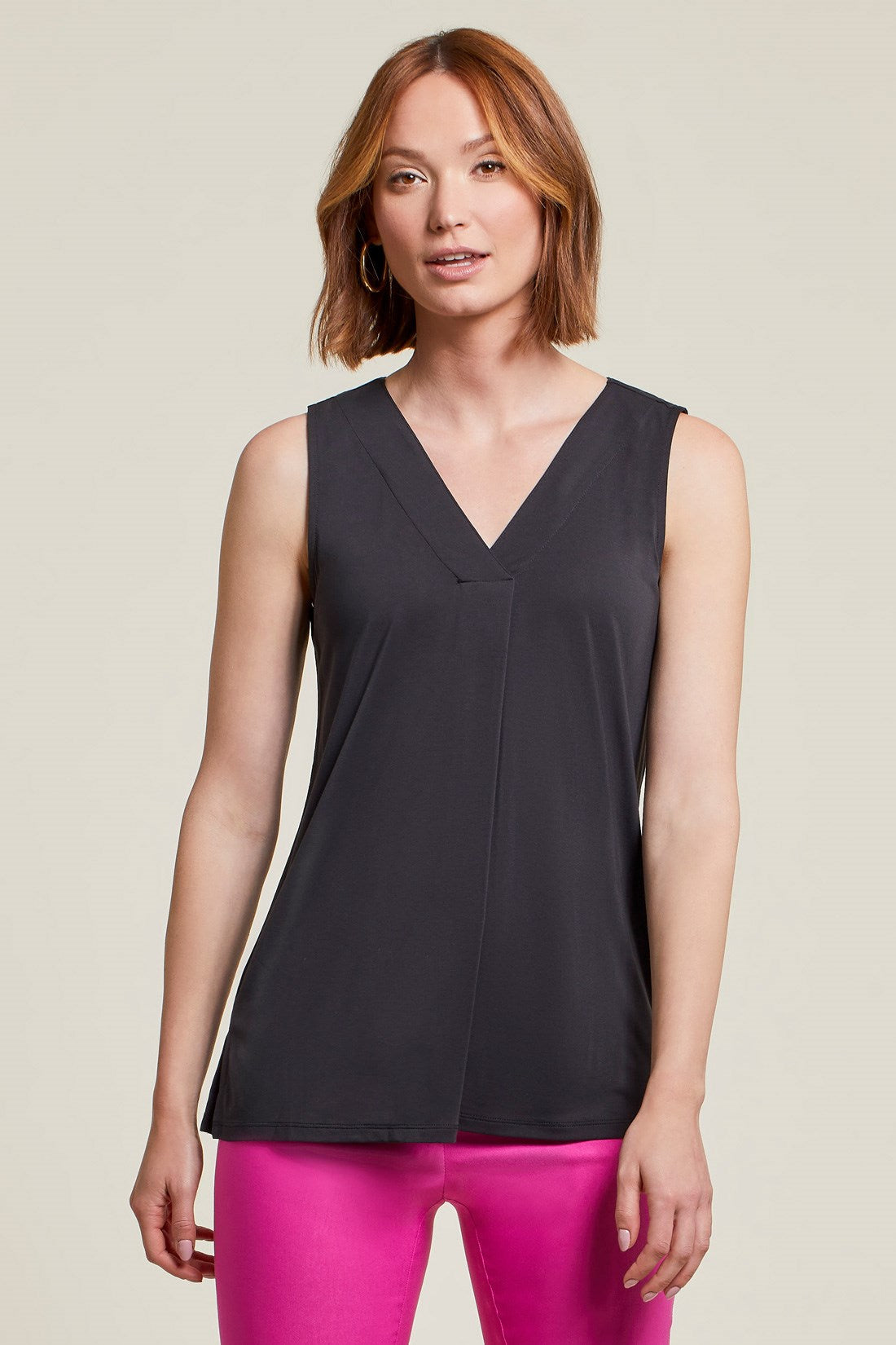 You're not dreaming, you're just wearing this super soft modal-blend top that exudes (almost) unbelievable style and comfort! We're loving the cool sleeveless cut, flowy fit, pop-over v-neck, center front pleat, and side-slit hemline. It elegantly accents and flawlessly matches any bottoms you combine it with.